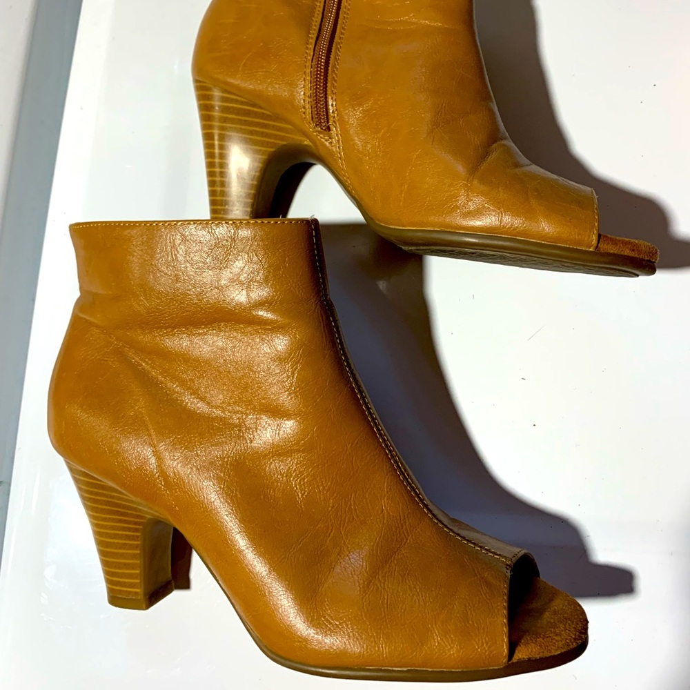 Leather peep-toe ankle booties.
